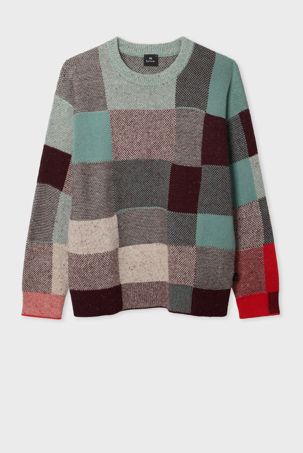 Patchwork sweater with multicolor squares on a white background