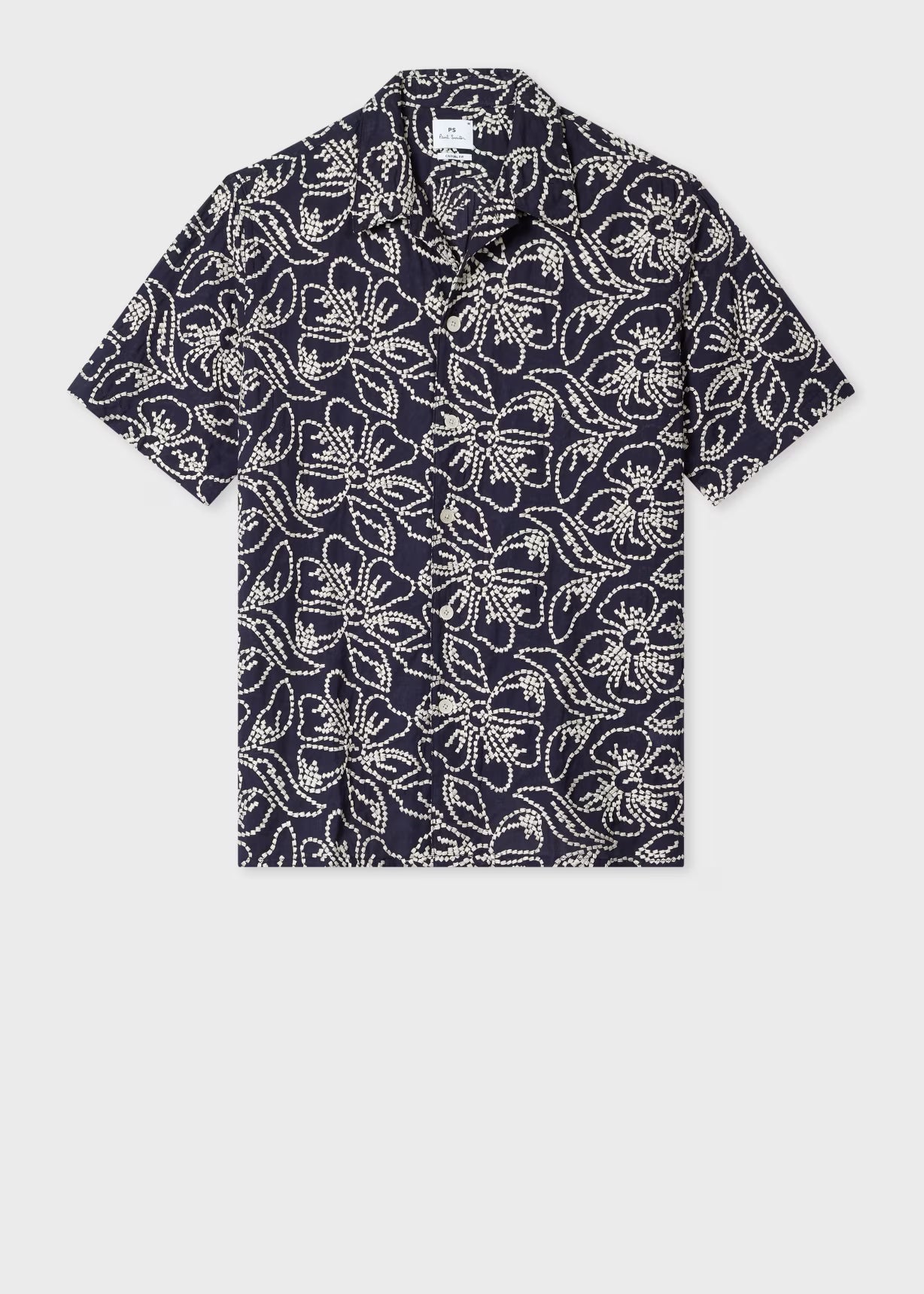 Navy blue shirt with white floral pattern on a light gray background