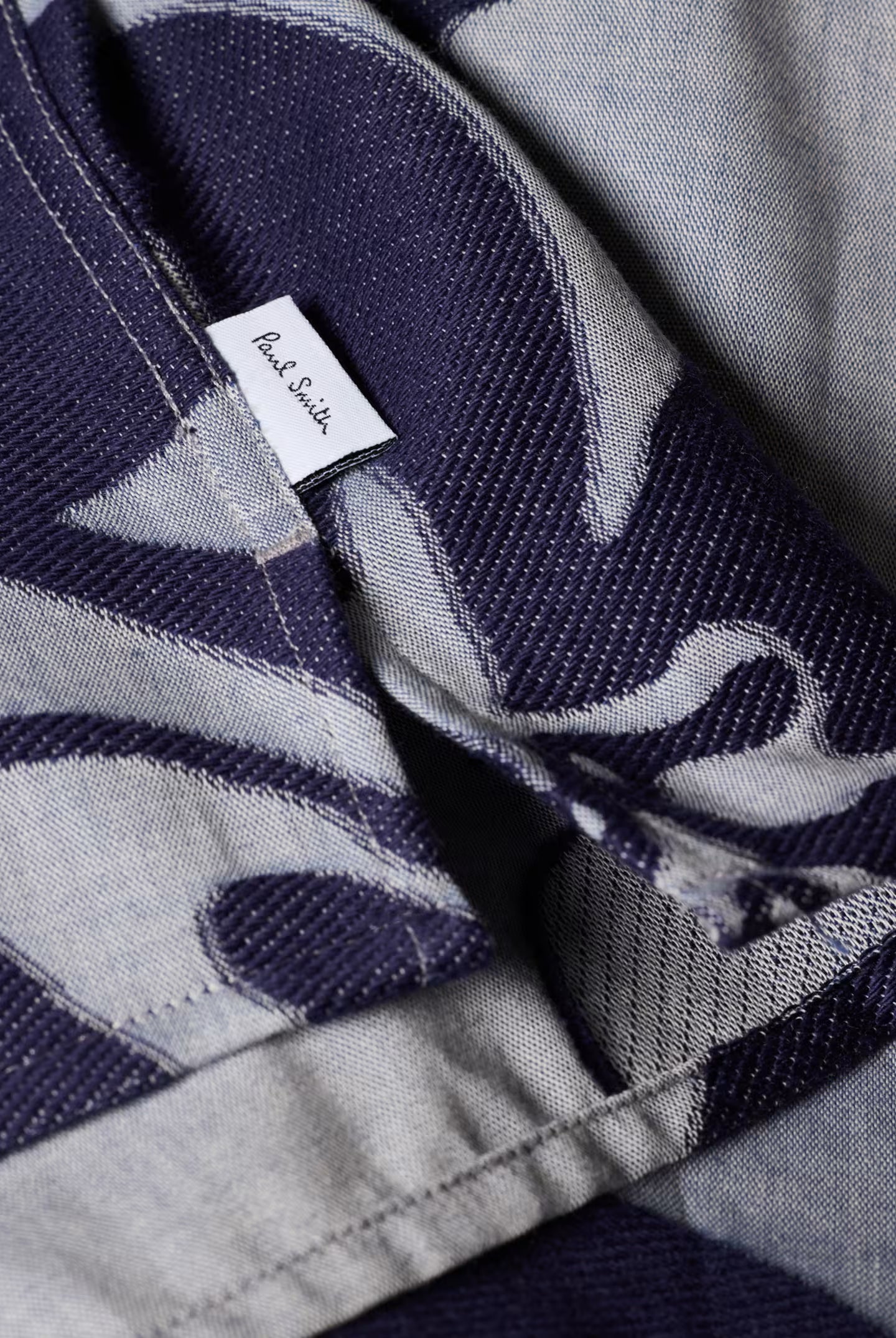 Close-up of a patterned fabric with a Paul Smith label.