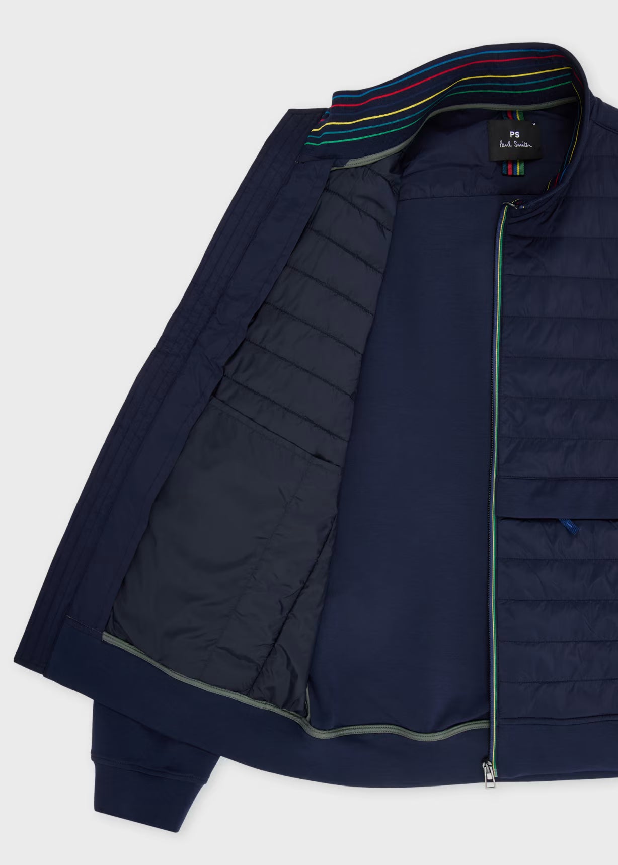 Navy blue puffer jacket with a colorful lining on a white background