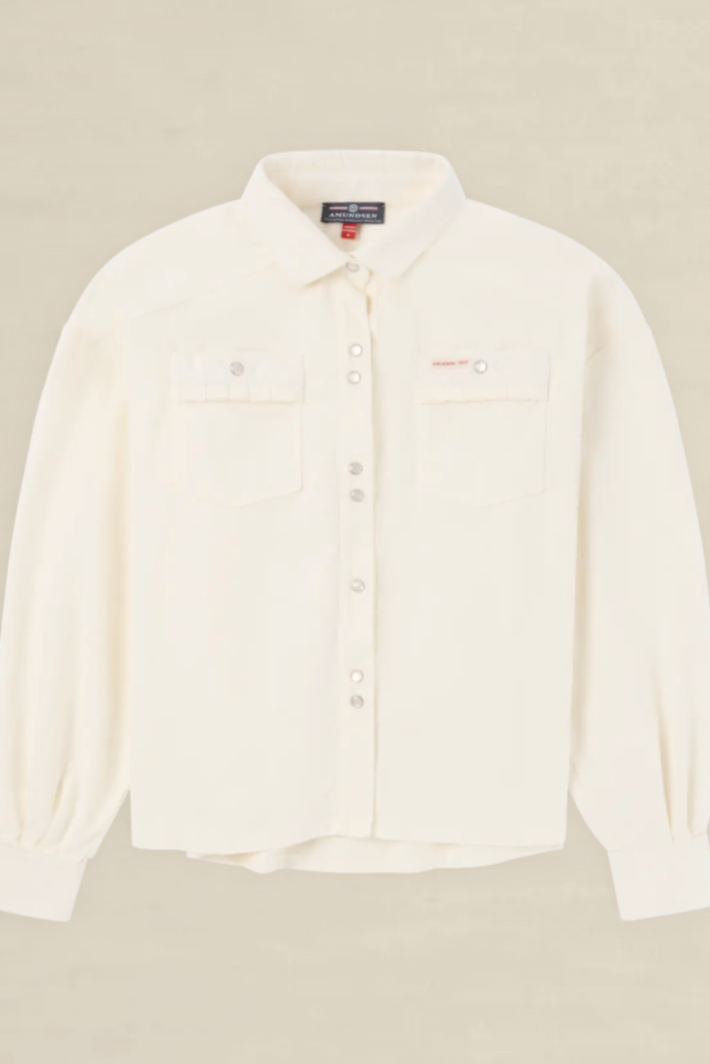 An off-white long-sleeve button-up shirt with two chest pockets, laid flat against a light beige background.