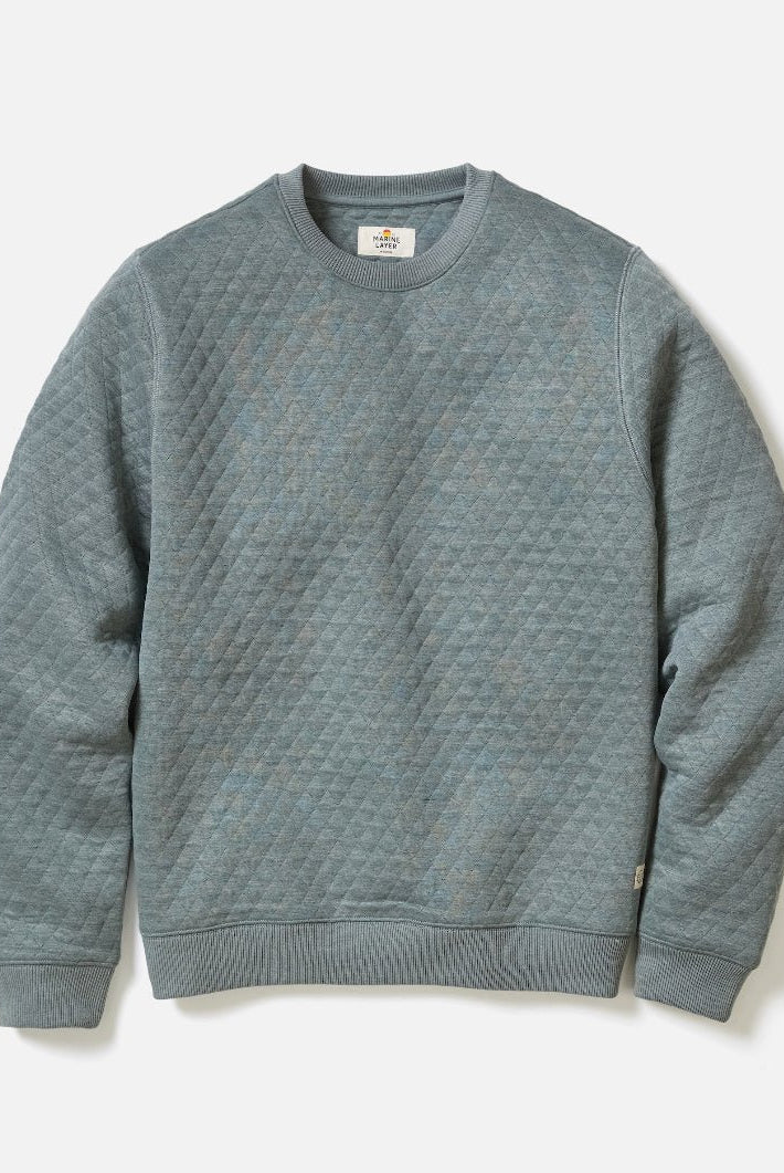 Gray textured sweater on a light gray background