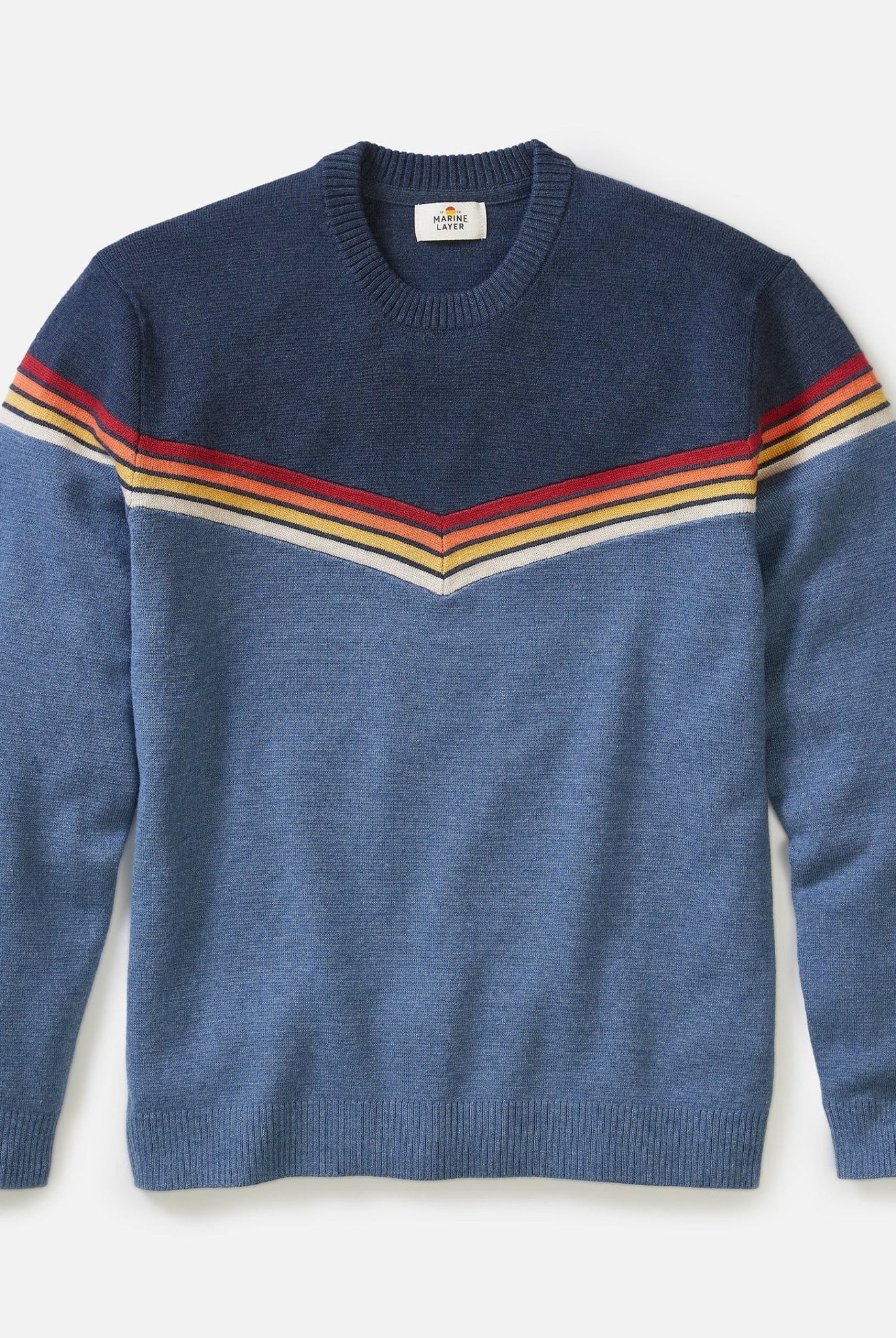 Blue sweater with colorful stripes on a light gray background