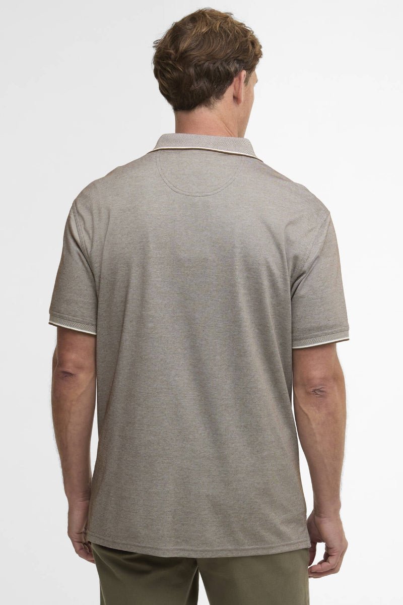 Man wearing a gray polo shirt on a white background