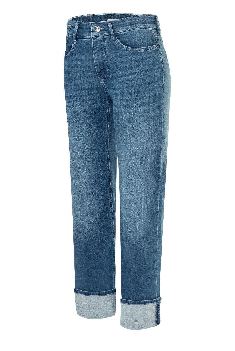 Blue jeans with rolled-up cuffs on a white background