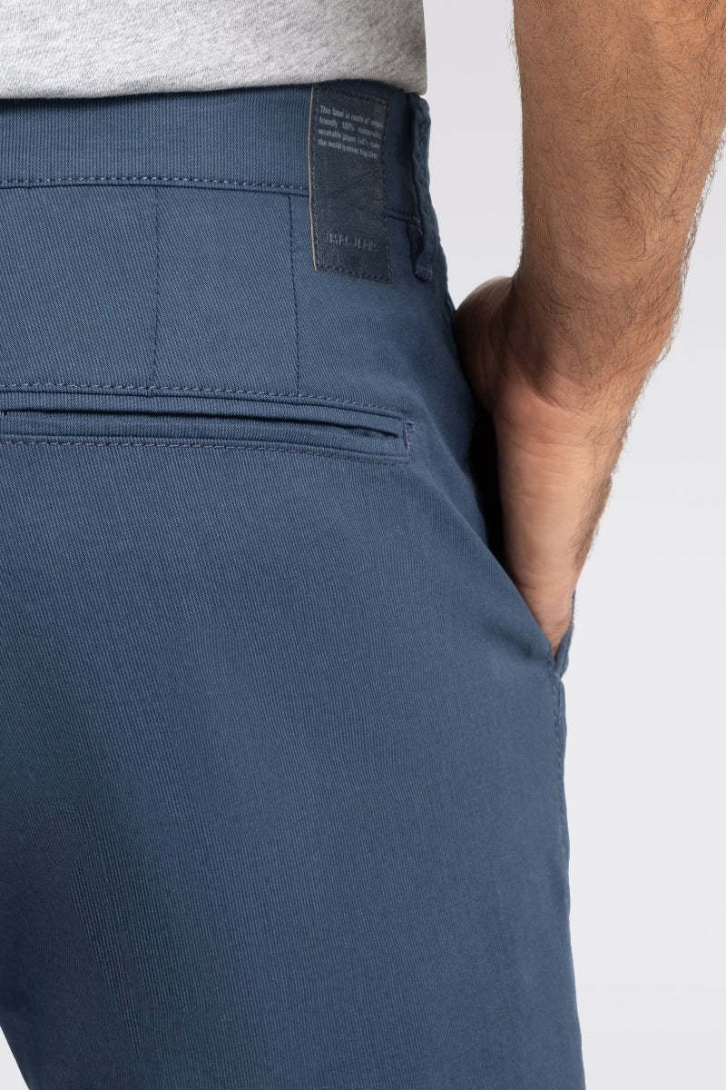 Close-up of blue pants with a white background