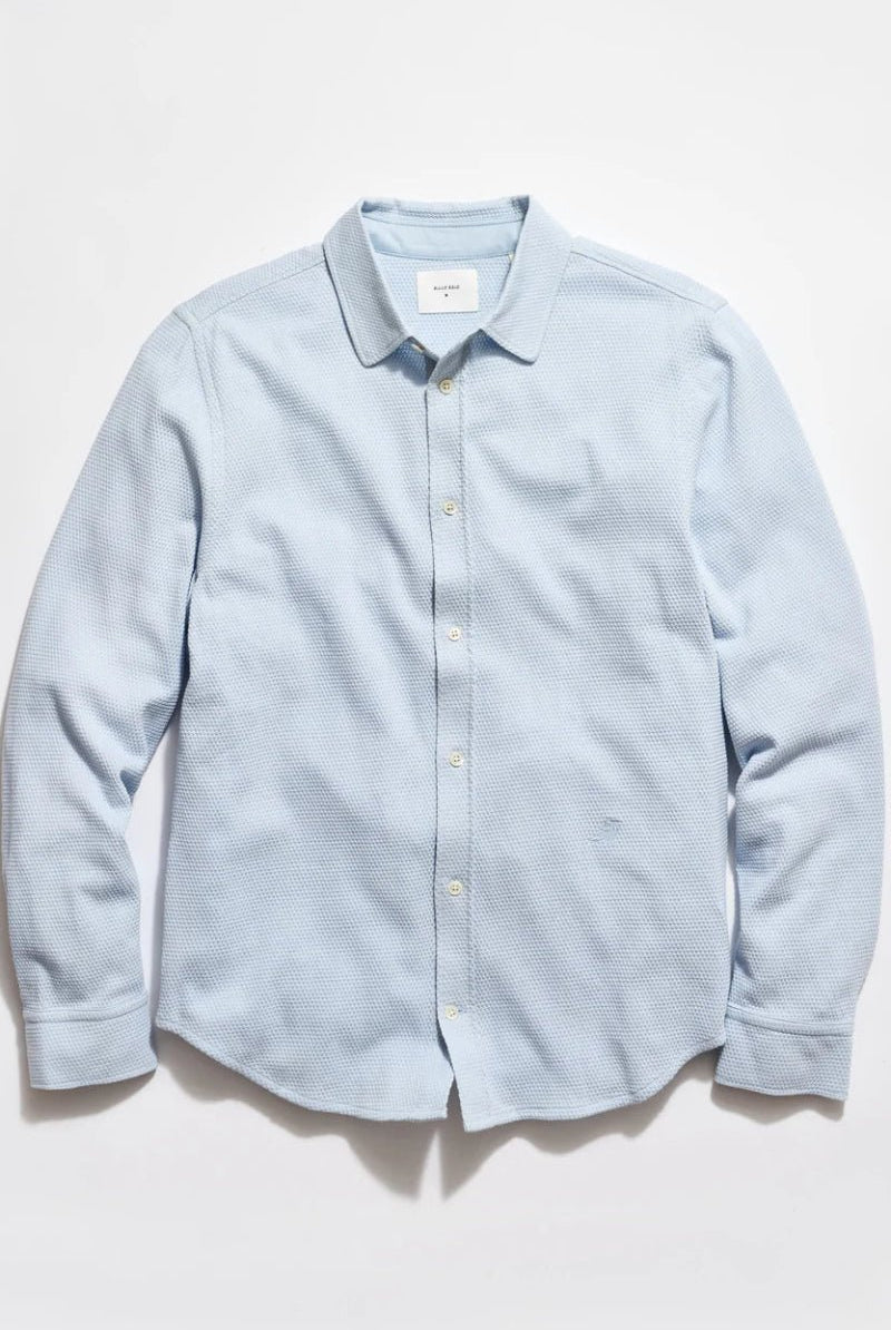 Light blue textured shirt on a white background