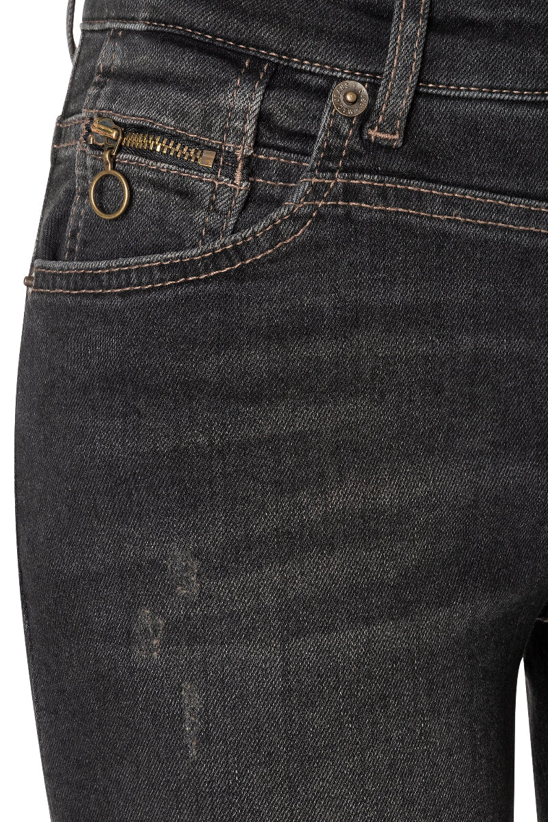 Close-up of dark blue jeans with visible stitching and buttons on a white background