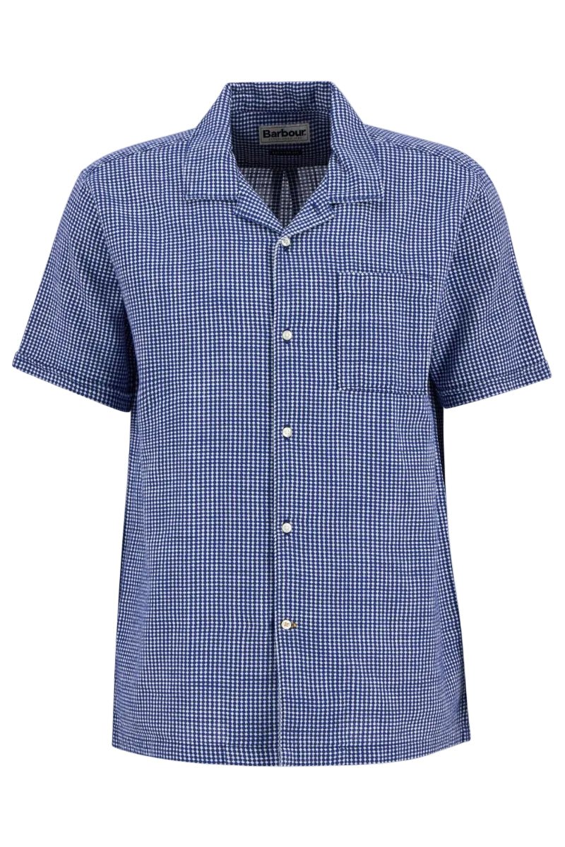 Blue checkered shirt with short sleeves on a white background