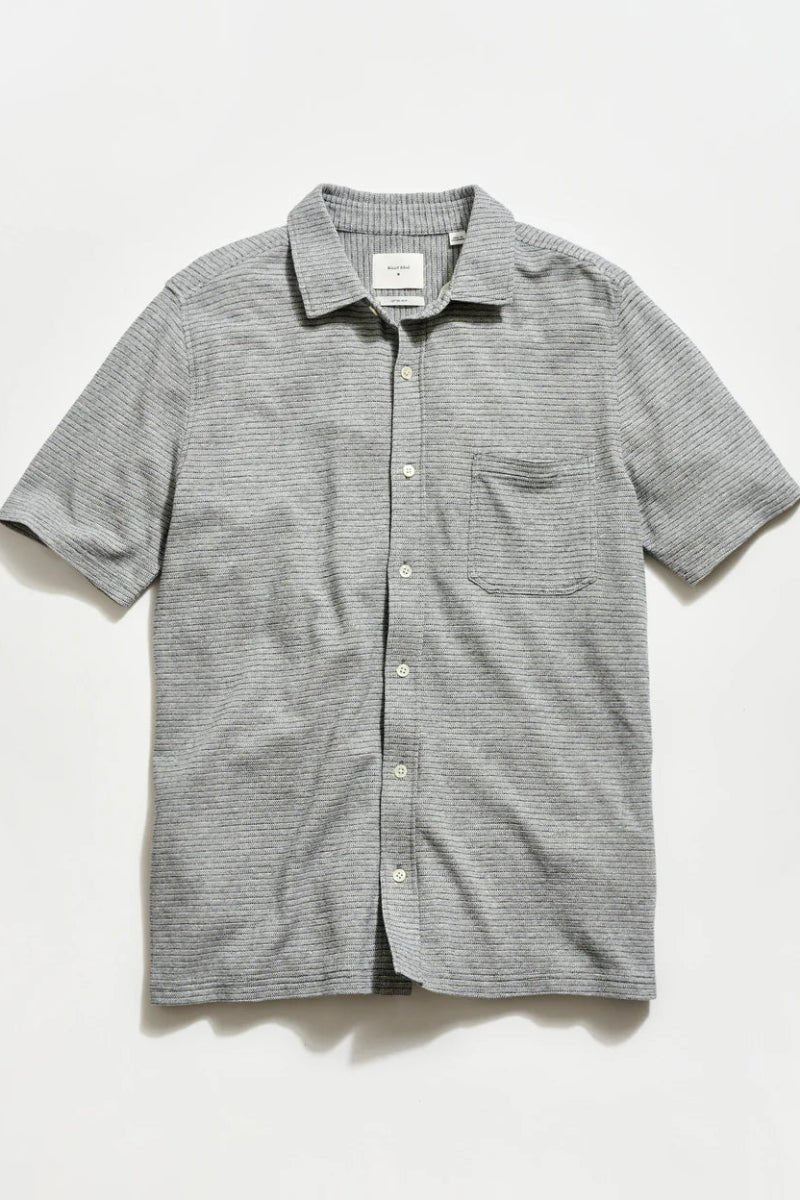 Gray striped short-sleeve shirt on a light gray background