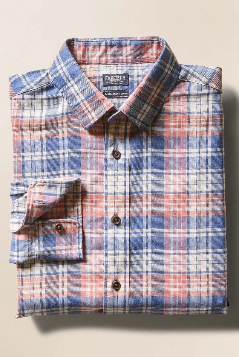 Folded plaid shirt on a beige background
