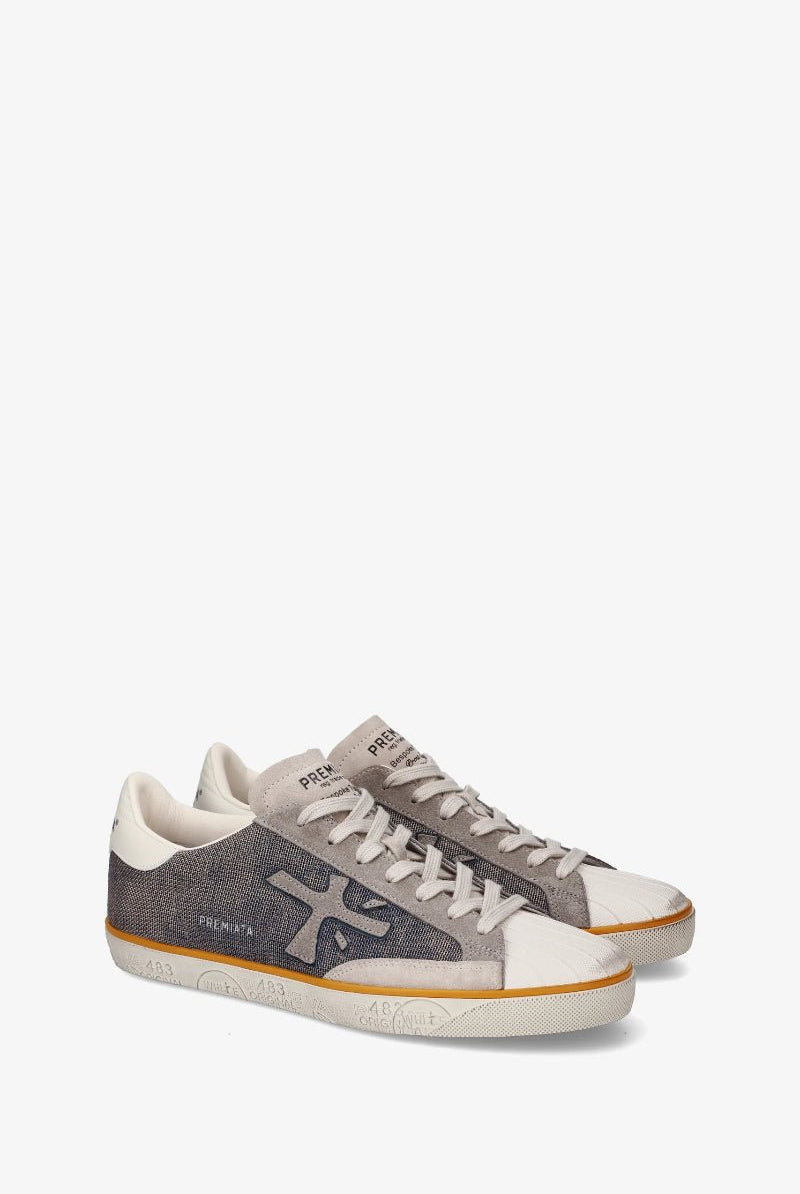 Pair of gray and white sneakers on a white background