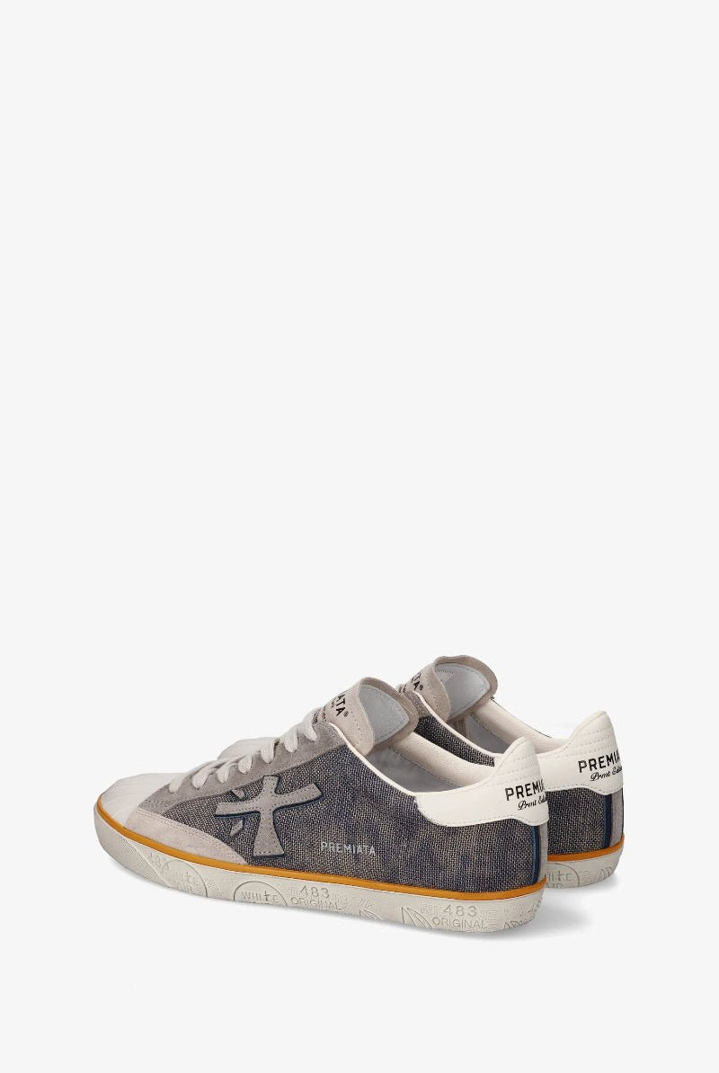 Pair of gray and white sneakers on a white background