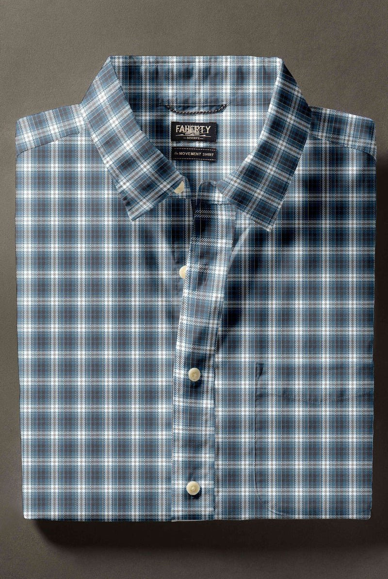 Blue plaid shirt with a label on a dark background
