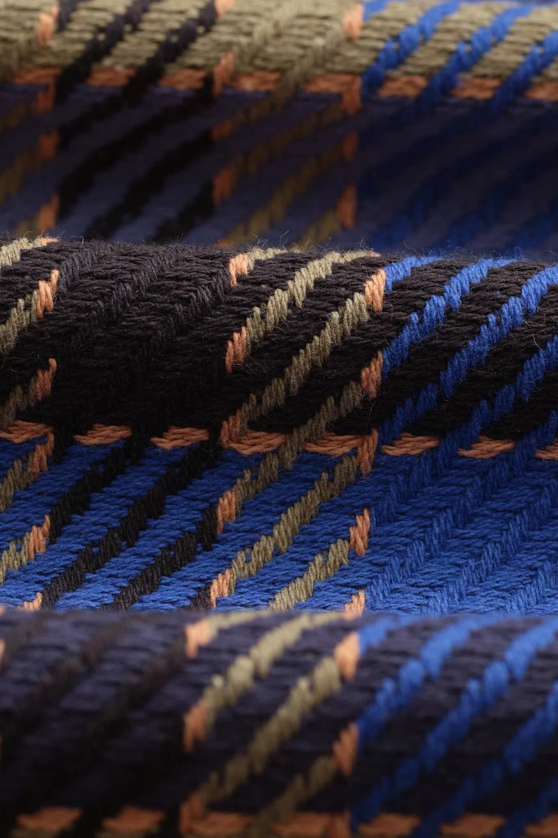 Close-up of blue and black textured fabric with a pattern