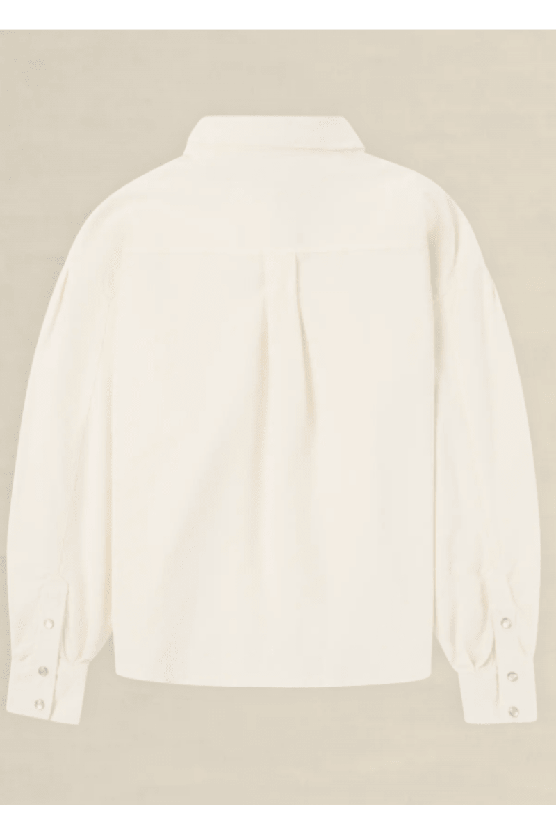 An off-white long-sleeve button-up shirt shown from the back, featuring a subtle pleat detail at the center back and buttoned cuffs, displayed against a neutral beige background.