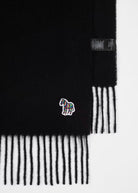 Black and white striped scarf with a colorful zebra emblem on a white background