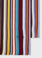 Multicolored striped fabric with a brand logo on a white background