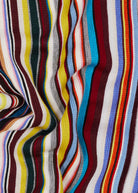 Close-up of a multicolored striped fabric with wavy pattern