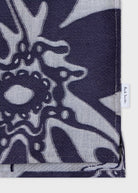Navy blue and gray patterned fabric with a brand label on a white background