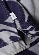 Close-up of a patterned fabric with a Paul Smith label.