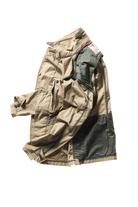 Beige and green jacket on a white background