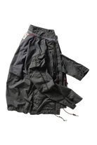 Black jacket with multiple pockets on a white background