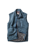 Blue quilted vest on a white background