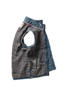 Quilted dog vest with gray and blue pattern on a white background