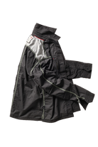 Black jacket with a white label on a white background