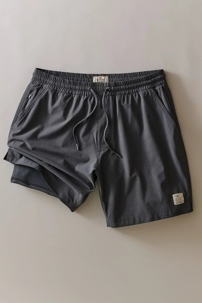 Pair of gray shorts on a light beige background