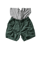 Green shorts with a gray shirt on top on a white background