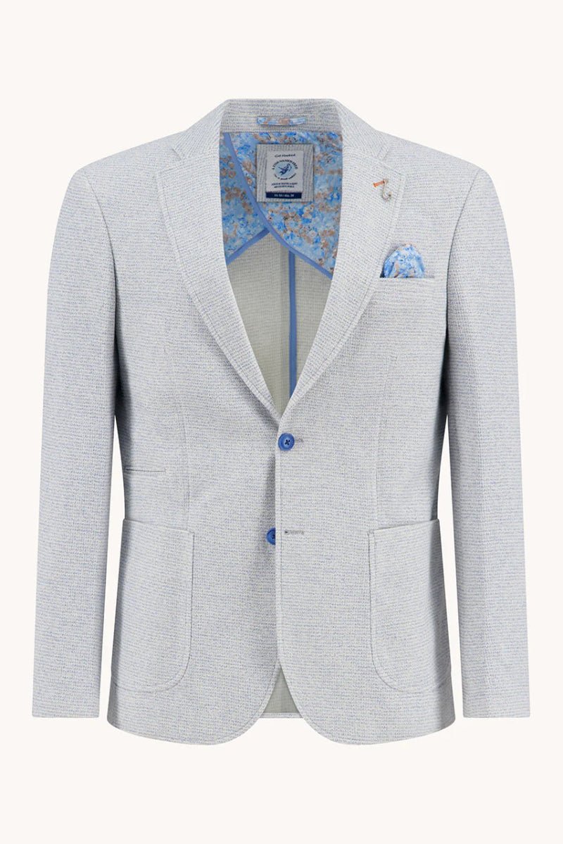 Light gray blazer with blue patterned lining and pocket square on a white background