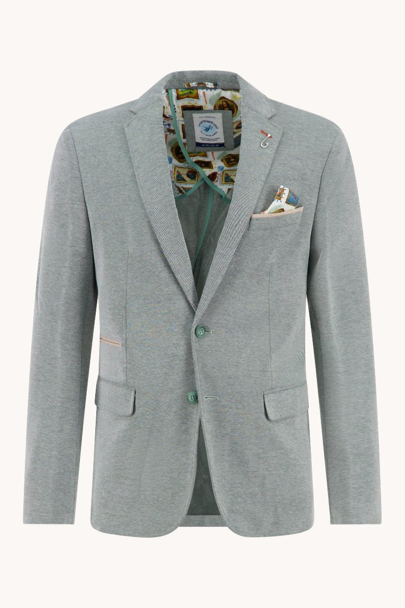 Gray blazer with patterned shirt and pocket square on a white background
