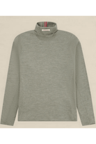 A light gray long-sleeve mock neck sweater with a subtle heathered texture, laid flat against a light beige background. A small red, white, and blue striped brand tag is visible inside the collar.