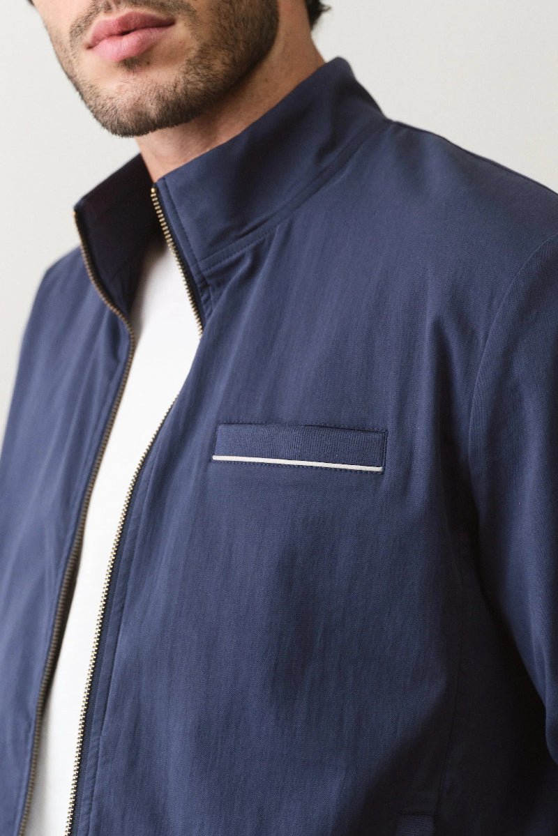 Navy blue jacket with a white background