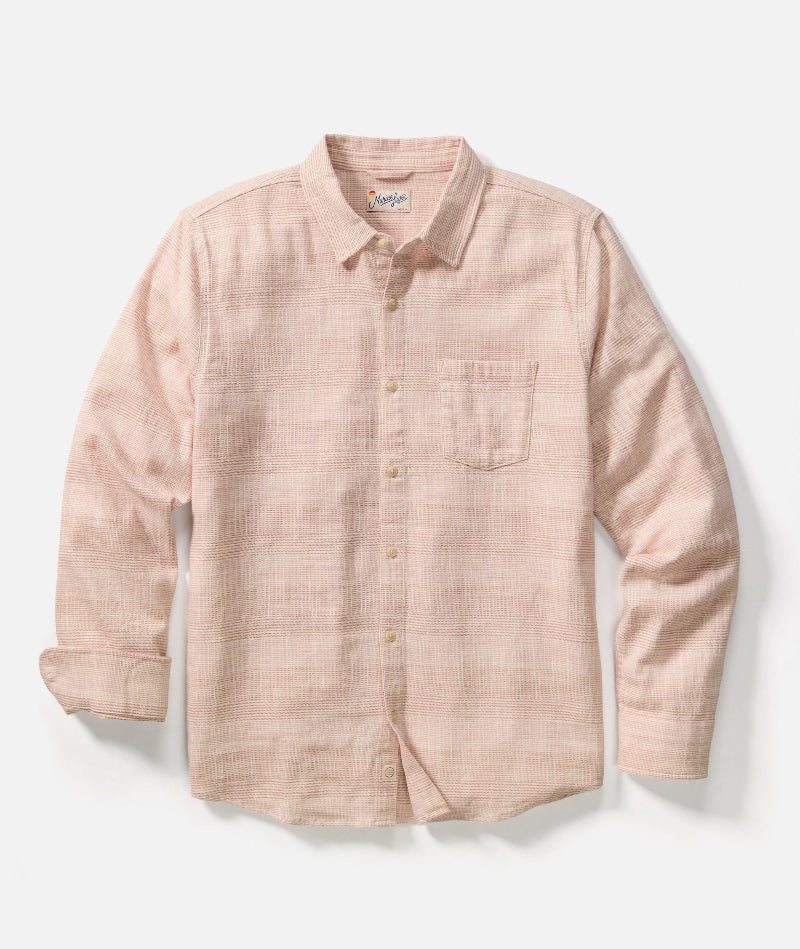 Pink checkered shirt on a light gray background