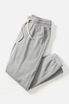 Gray sweatpants with a drawstring on a white background