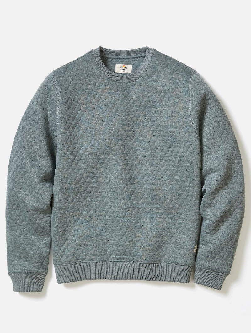Gray textured sweater on a light gray background