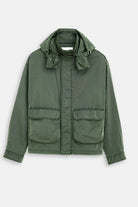 Green jacket with a hood on a light gray background