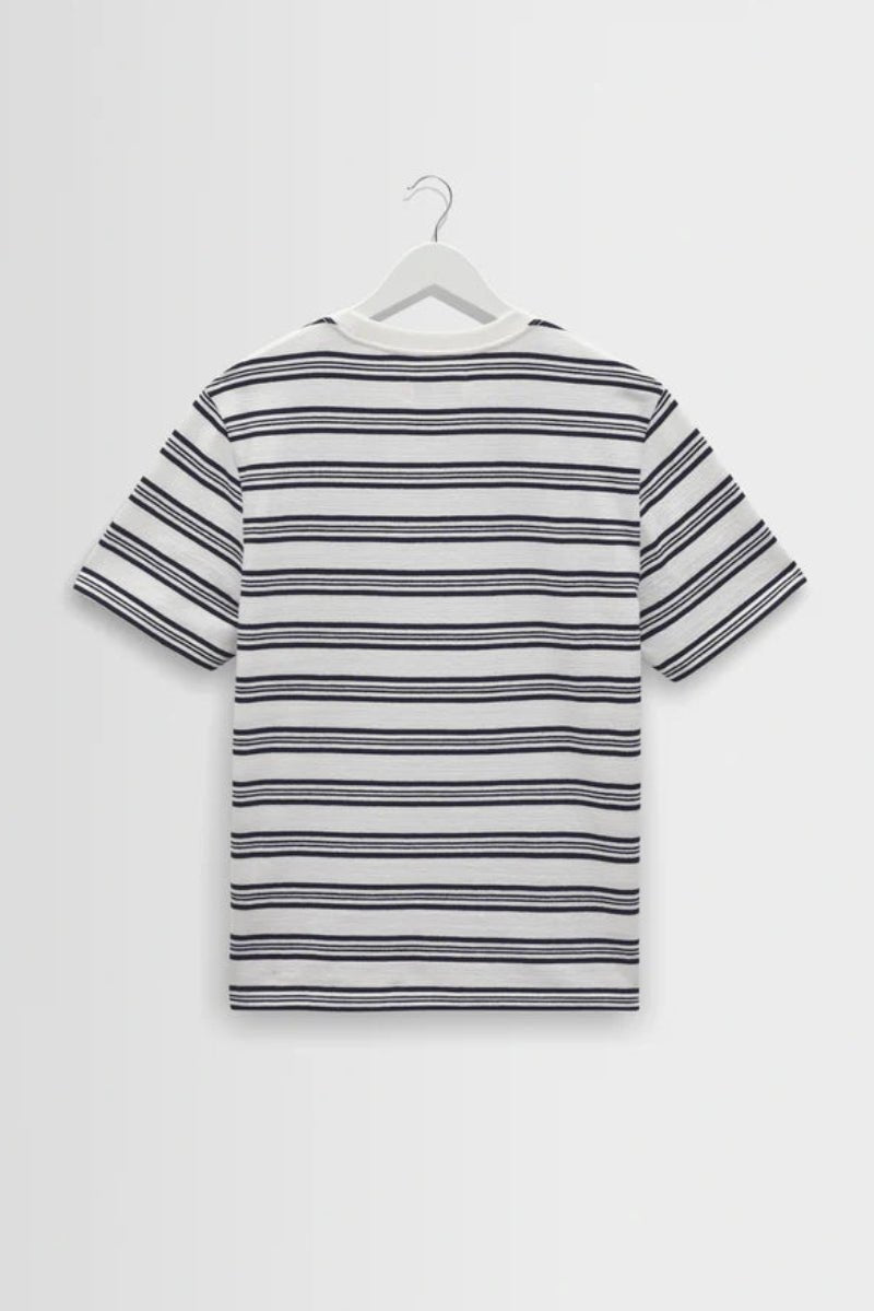 Striped t-shirt on a hanger against a white background