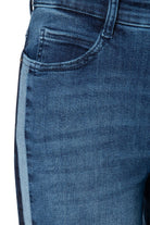 Close-up of blue jeans on a white background