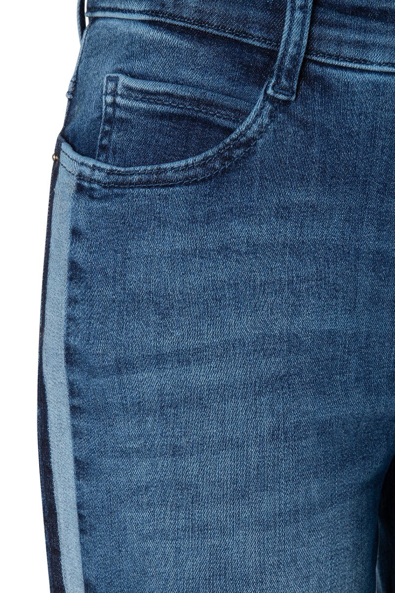 Close-up of blue jeans on a white background