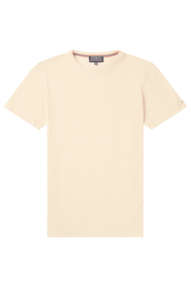 Beige t-shirt with a brand label on a white background