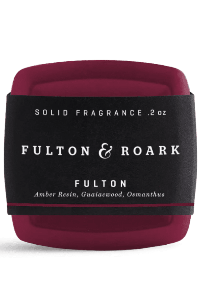 Solid fragrance container with 'Fulton & Roark' branding on a white background