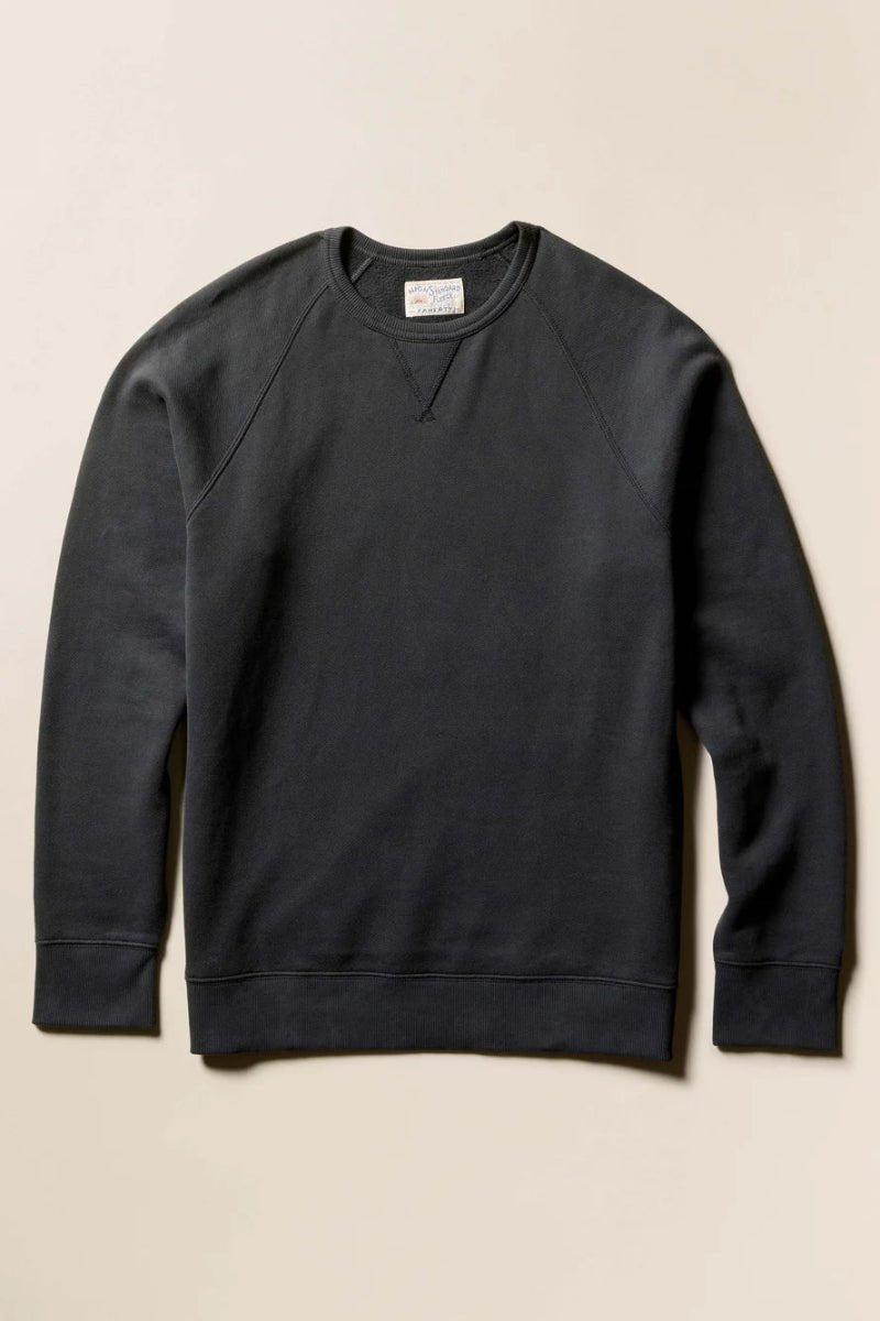 Black sweatshirt on a beige background