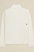 A white textured long-sleeve mock neck sweater shown from the back, featuring a small black embroidered mouse cursor logo on the left side, set against a solid beige background.