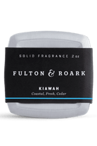 Solid fragrance stick by Fulton & Roark with black label on a white background
