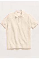 Beige striped polo shirt on a light gray background