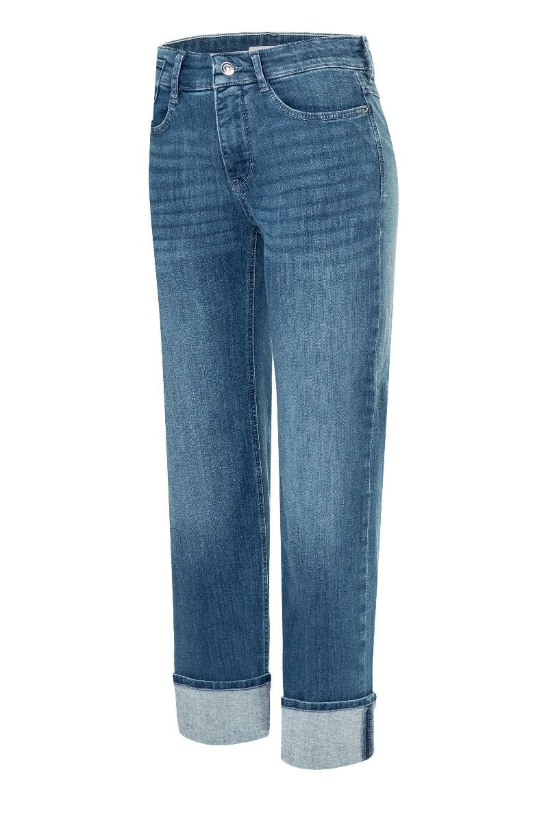 Blue jeans with rolled-up cuffs on a white background